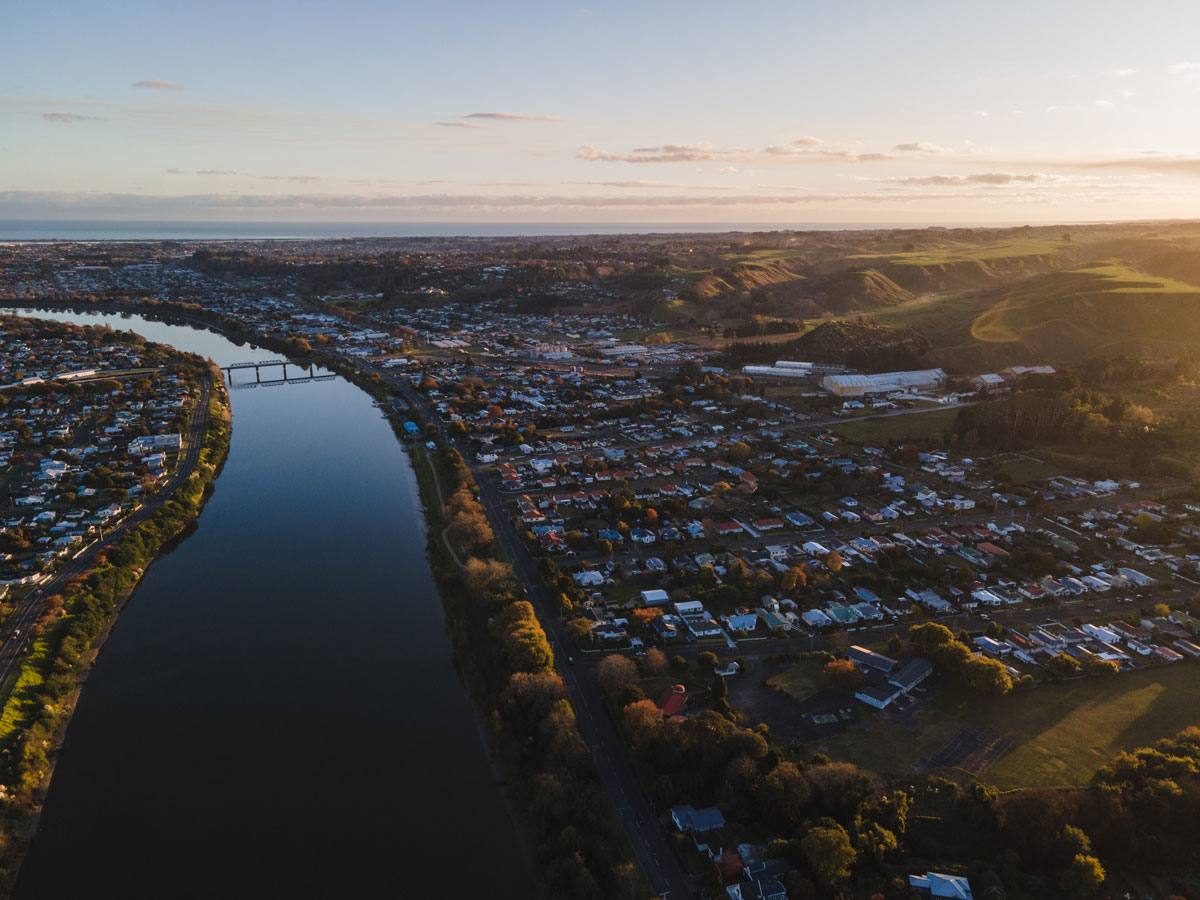 A birds eye view of the Whanganui River, showing the suburb of Aramoho and the Railway Bridge
